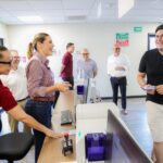 Marina del Pilar Avila Olmeda atiende a un ciudadano durante la apertura de la subrecaudación en Palaco, Mexicali